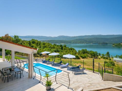 Garjak House | Holiday Home Escape on lake by Interhome