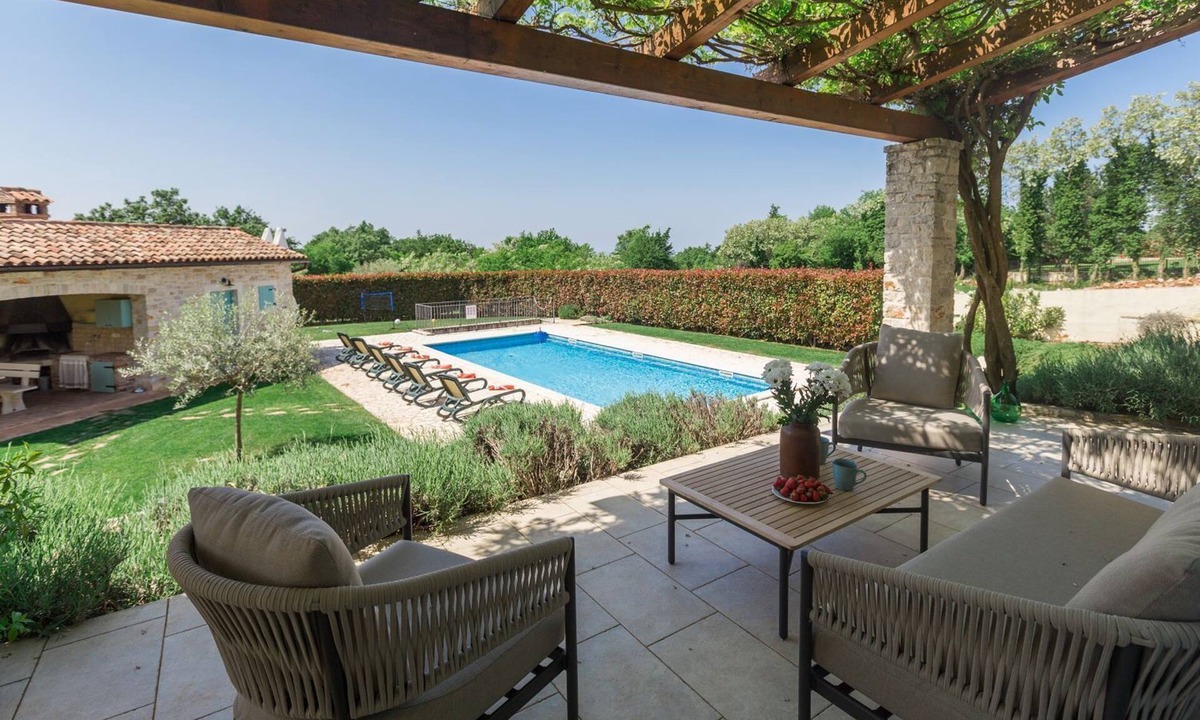 Heraki House | Mediterranean stone villa with heated private pool, aromatic Mediterranean plants
