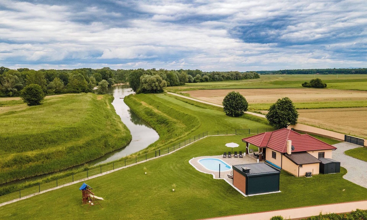 Pitomaca House | Riverside retreat with pool, summer kitchen, playground, and peaceful Drava views.