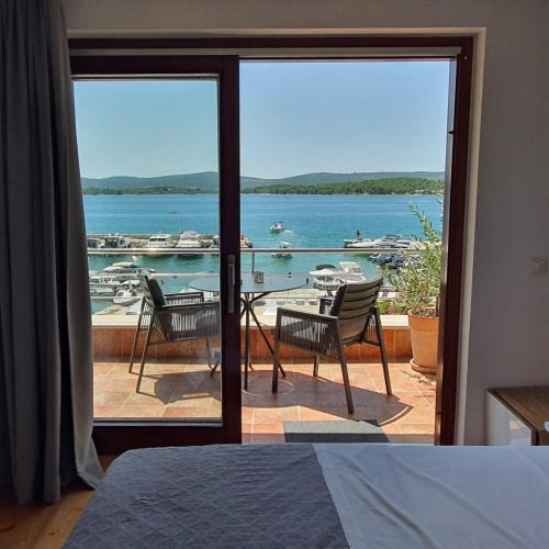 Turanj Apartment | Seafront Apartments Villa Oliva with Private Boat Mooring