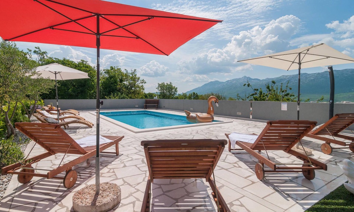 Koprivno House | This comfortable holiday home with pool is situated on a hill surrounded by nature and woodland.