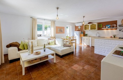 Tribalj Apartment | Charming apartment with Mediterranean garden, pool, high chair, cot, BBQ