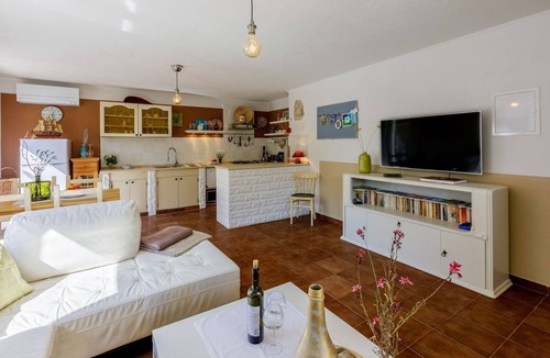 Tribalj Apartment | Charming apartment with Mediterranean garden, pool, high chair, cot, BBQ