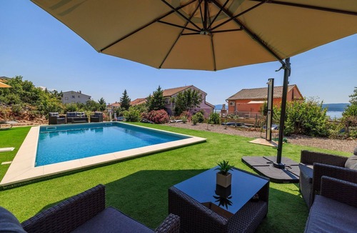 Dramalj Apartment | Comfortable flat just 350 metres from the beach with sea views, pool, outdoor shower