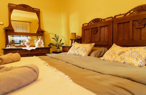 Bilje House | Cozy 3-bedroom farmhouse surrounded by a vibrant garden full of plants.