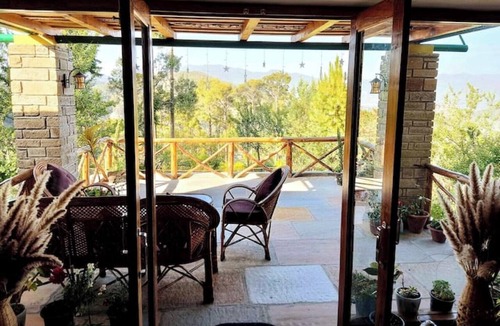 Almora House | Cozy bungalow nestled in the Himalayas, snow-capped peaks, Kumaoni culture.