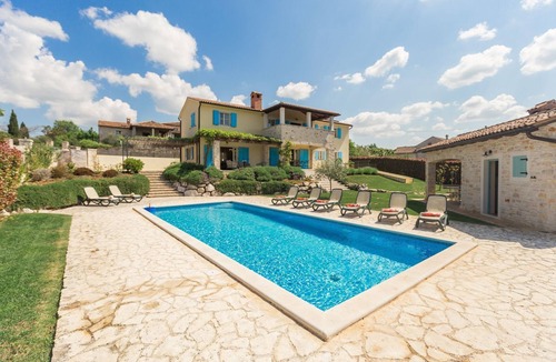 Heraki House | Mediterranean stone villa with heated private pool, aromatic Mediterranean plants
