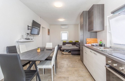 Polje Apartment | On the island of Krk welcomes you this beautiful apartment with shared pool.