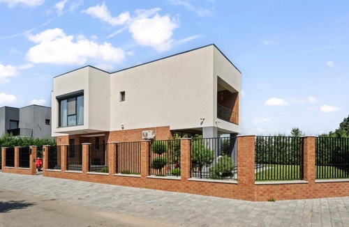 Corbeanca Villa | Red Brick Villa by the Forest