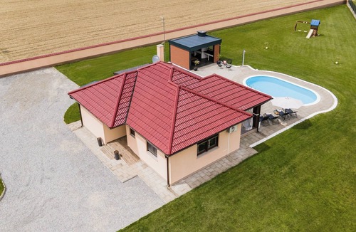 Pitomaca House | Riverside retreat with pool, summer kitchen, playground, and peaceful Drava views.