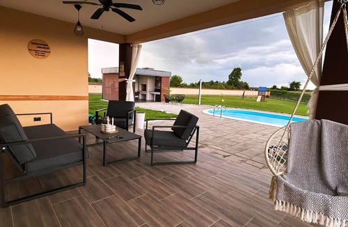 Pitomaca House | Riverside retreat with pool, summer kitchen, playground, and peaceful Drava views.