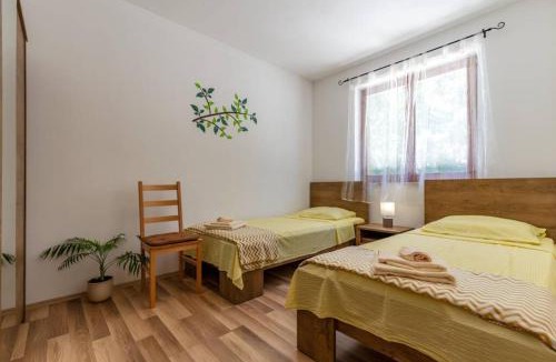 Stokovci House | Sunny yellow house with a pool