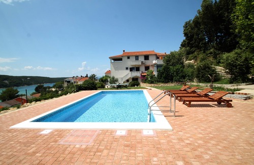 Kampor Apartment | Two bedroom apartment with a swimming pool Kampor, Rab (A-15518-b)