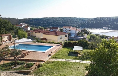 Kampor Apartment | Two bedroom apartment with a swimming pool Kampor, Rab (A-15518-b)