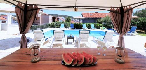 Okrug Gornji Villa | Villa Mendula Trogir - Luxury villa by the beach - heated pool - lush green garden
