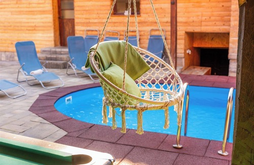 Tounj House | Wooden forest home with pool, fireplace and playground for kids