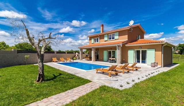 A bright and serene holiday home with private pool and children's playground in Marcana
