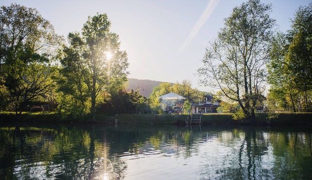 A modern Villa with a spacious yard ending with a beach on the river Una. in Bihac