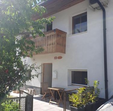 ALPINE VILLAGE APARTMENT with a private terrace, garden, and parking - at a walking distance from LAKE BLED in Bohinjska Bela