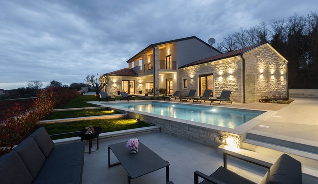 An oasis of peace, featuring wellness facilities, a playground, a pool, and a barbecue area in Mofardini