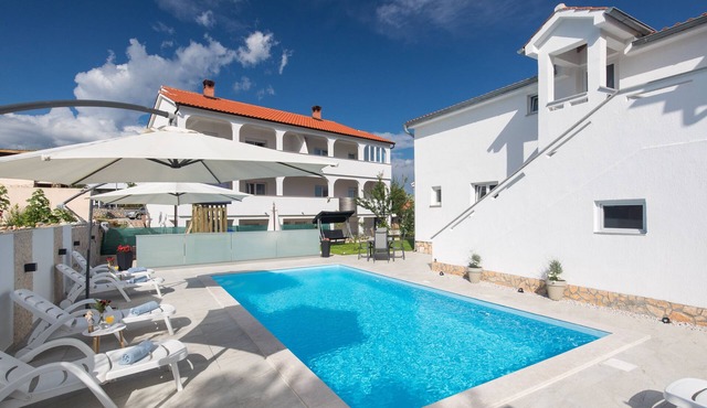 Apartment LiJan °2 with heated saltwater pool, garden, children's playground