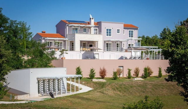 Design Villa Aqua * with 48m² pool, golf court, fitness & spa house