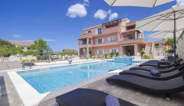 Holiday apartment with pool for shared use