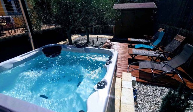 Holiday home with hot tub and sun terrace