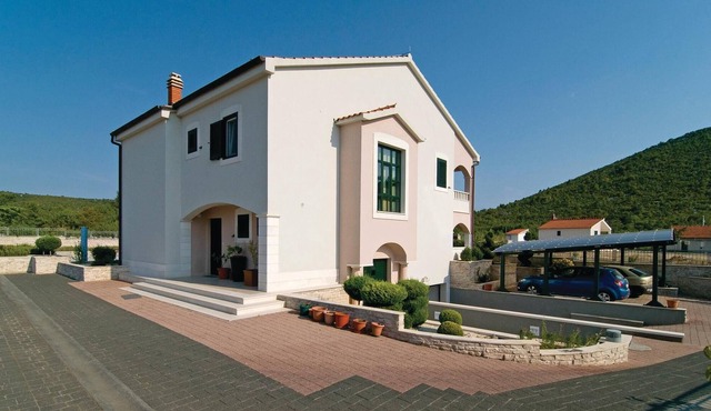In a small quiet place in a large garden is located this cottage with nicely furnished interiors.