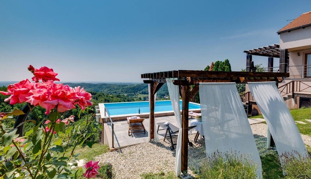 Inviting cottage on a hillside with swimming pool and spectacular views of the countryside.
