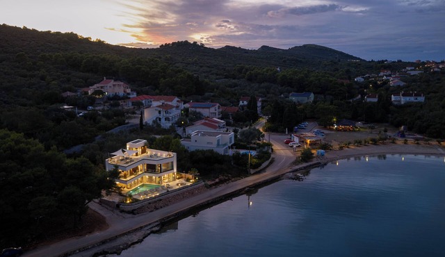 Luxury villa Zara, first row to the sea, with heated pool!