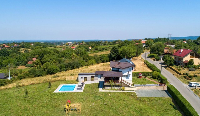 Modern home with pool and view