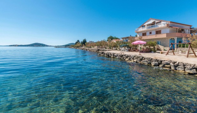 Modern vacation apartment directly by the sea.