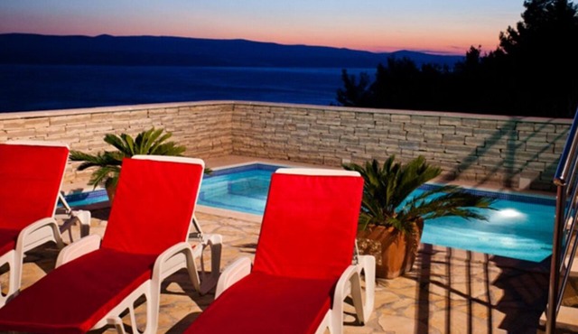 Modern vacation apartment with pool and sea view