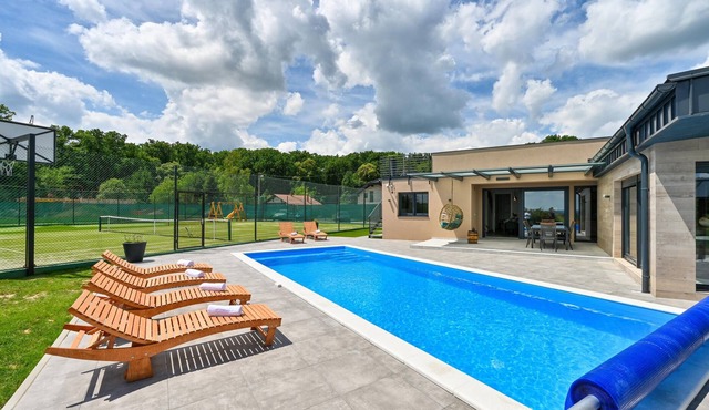 On the outskirts of Koprivnica is this modern vacation home with swimming pool and indoor spa area.