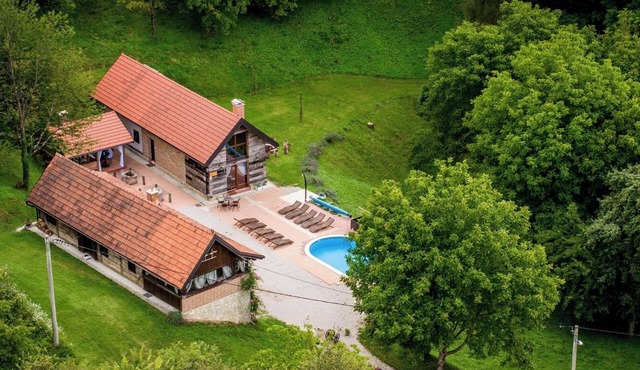Secluded estate with wellness, outdoor pool, and space for relaxation and gatherings.