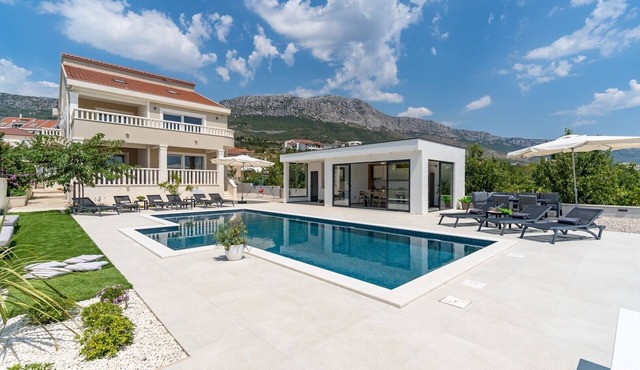 Villa Marisa with 51sqm heated, private pool, 5 bedrooms, 4 bathrooms, summer kitchen, views of the Adriatic sea and town Split