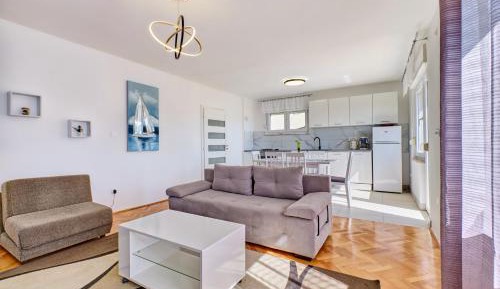 Three-Bedroom Apartment with Balcony and Sea View