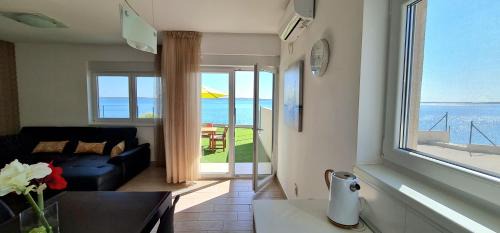 One-Bedroom Apartment with Garden and Sea View