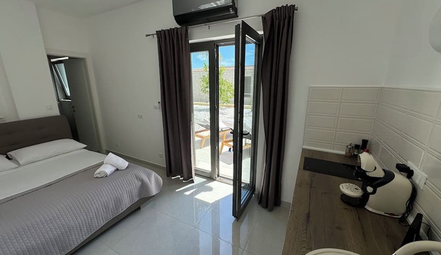 New studio in Mediterranean Garden only 50 meters from the sea. in Vis